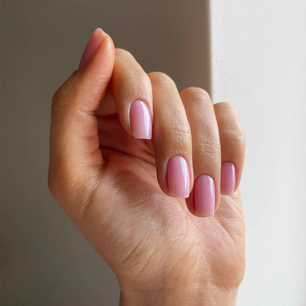 Close-up of Sheer Admiration polish on light skin – breathable, non-toxic sheer pink shade for everyday elegance