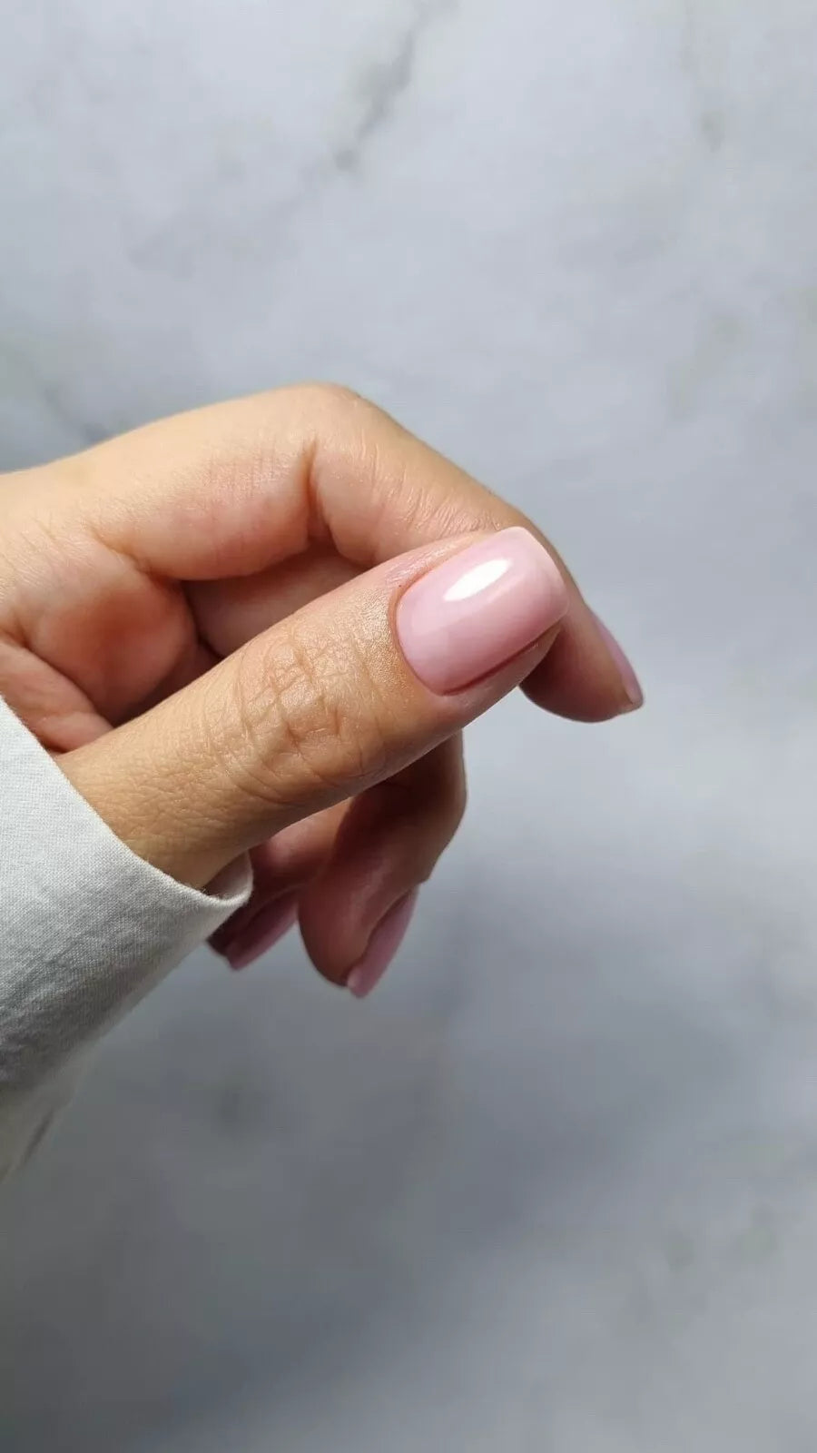 Nails featuring Bio Sculpture Sheer Admiration on light skin – translucent, vegan pink polish for a clean, natural finish