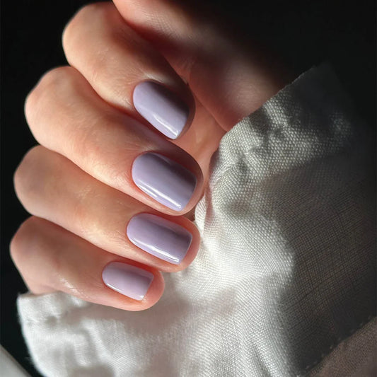 Hand with light skin tone wearing Nailberry Peony Blush – soft, vegan peony pink polish for a fresh, elegant manicure
