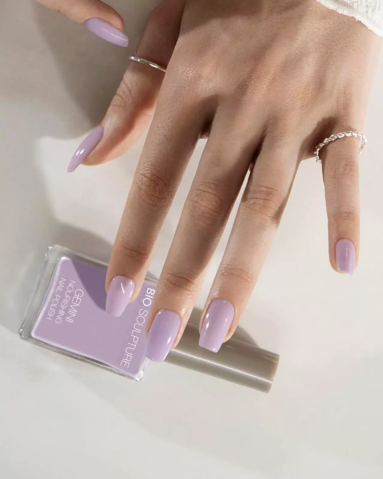 Close-up of light skin tone nails painted with Nailberry Peony Blush – breathable, non-toxic peony pink polish for a natural look