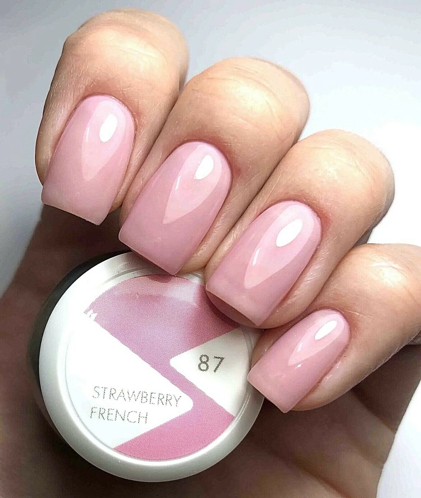 Nails featuring Bio Sculpture Gemini Nail Polish No. 87 Strawberry French on light skin – cruelty-free, gentle pink polish for a sophisticated, natural finish