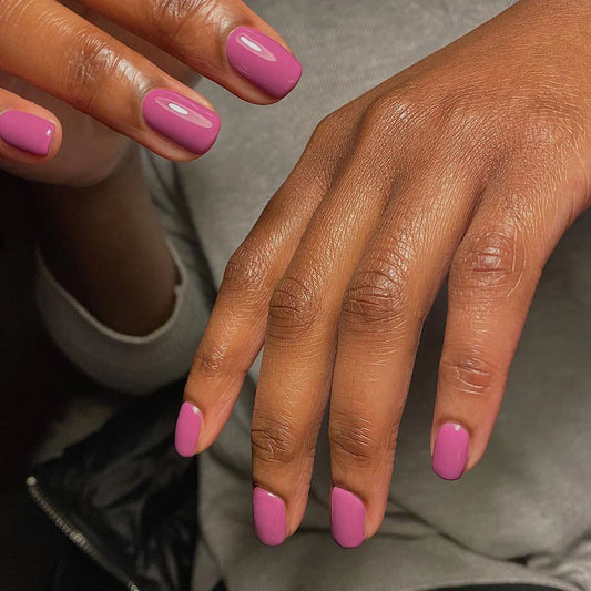 Close-up of Bio Sculpture Gemini Nail Polish No. 91 Royal Turban polish on light skin – non-toxic, deep purple shade for a striking, elegant nail look