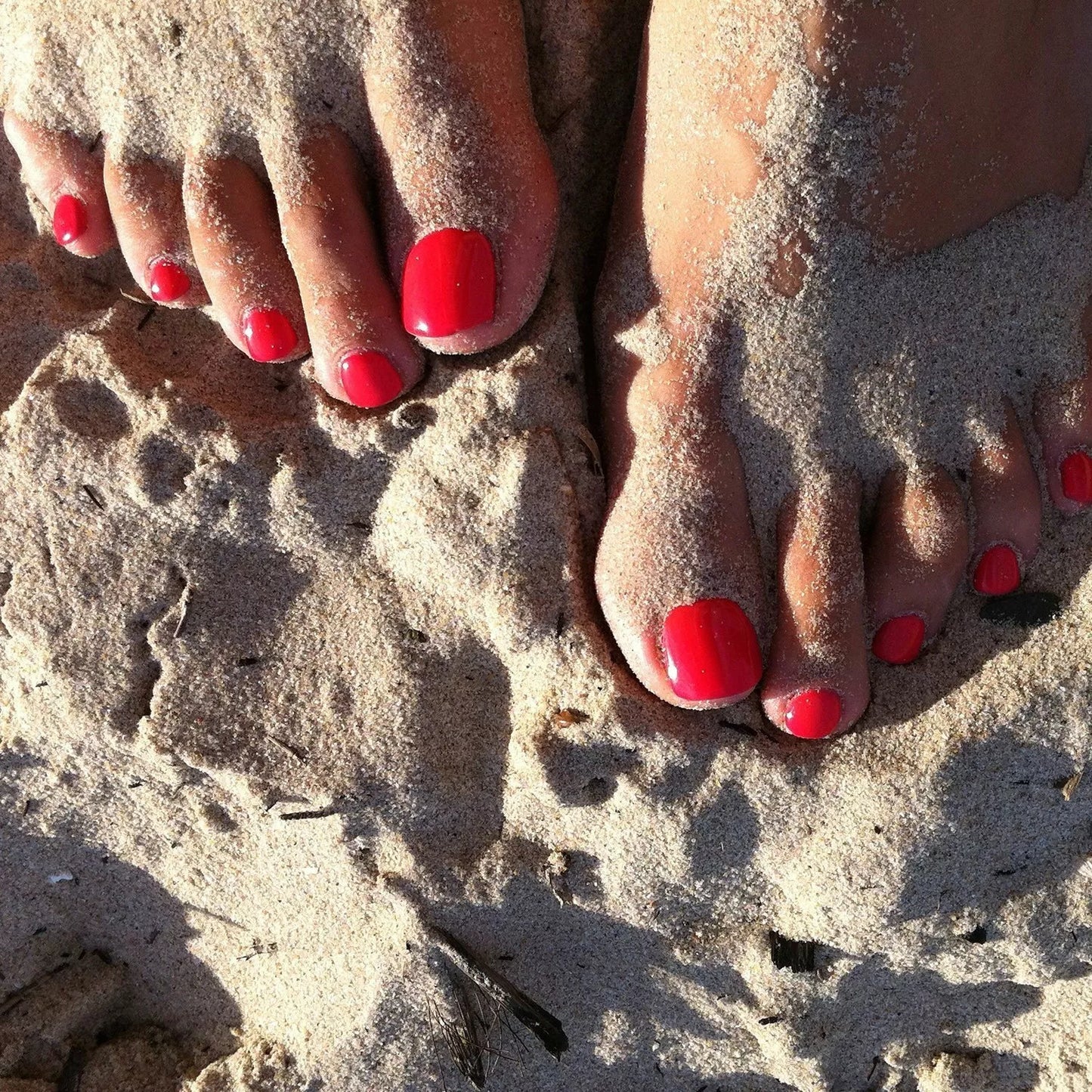 Hand wearing Bio Sculpture Gemini Nail Polish No. 95 Spring Splash – bold, vegan bright orange coral polish for inclusive, striking manicures