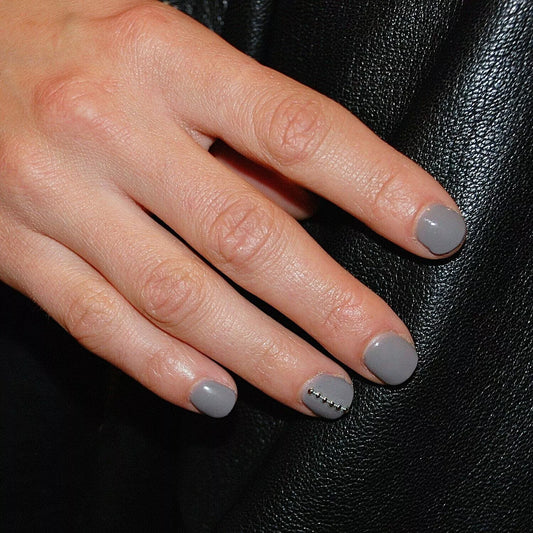 Close-up of Bio Sculpture Gemini Nail Polish No. 98 Soaring Dove polish on light skin – non-toxic, gentle grey shade for a refined, contemporary nail look