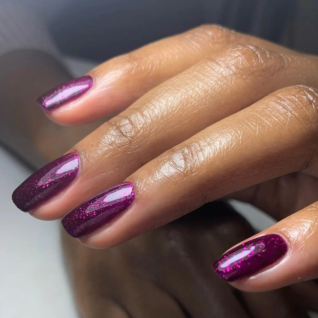 Close-up of Bio Sculpture Gemini Nail Polish No. 221 Party Popper polish on light skin – non-toxic, bold pink shade with a playful finish for a cheerful nail look