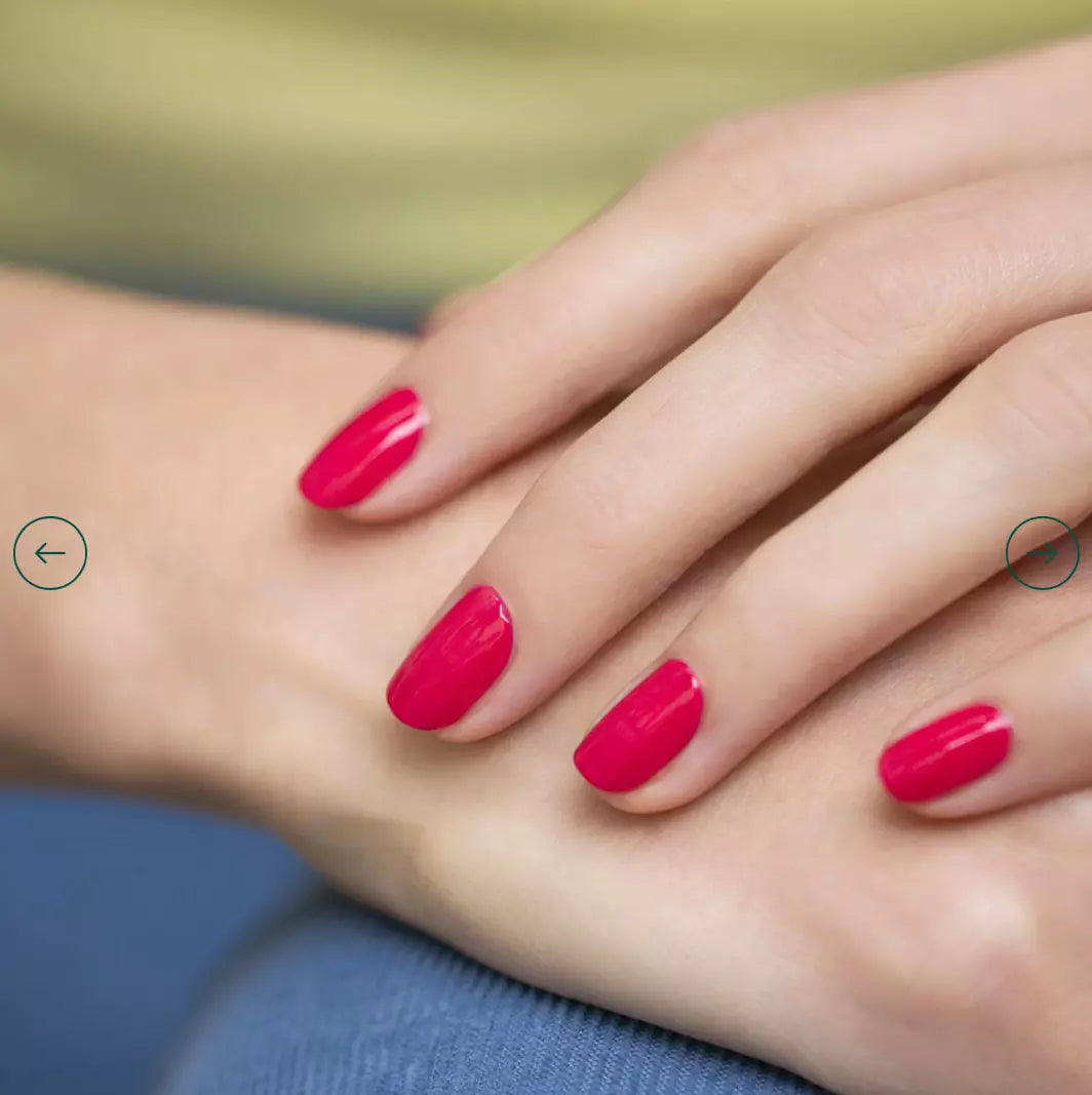 Hand with nails painted in Manucurist Peonie – lively, pastel pink vegan polish for a cheerful, modern manicure