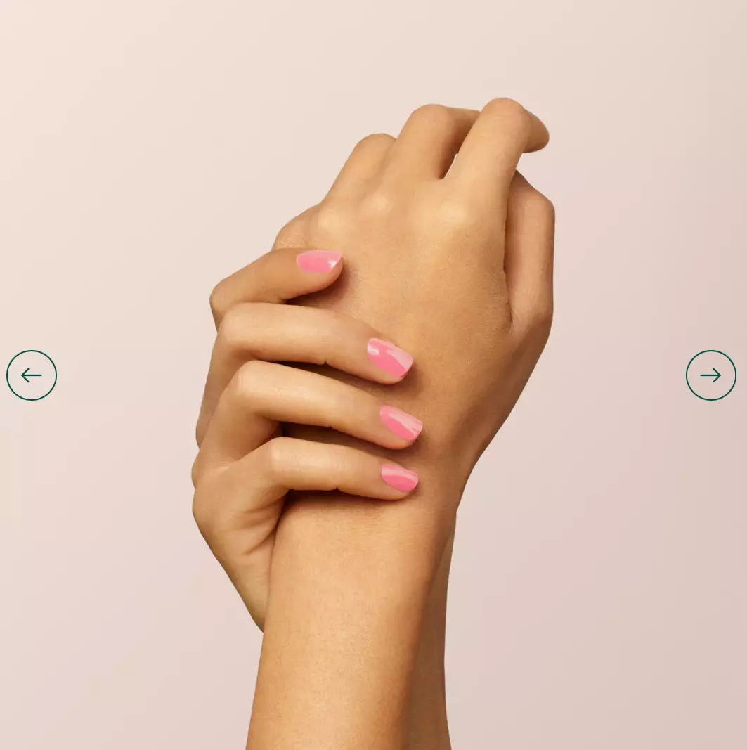 Hand with nails painted in Manucurist Pink Paradise – bold, vegan pink polish for a playful, modern manicure