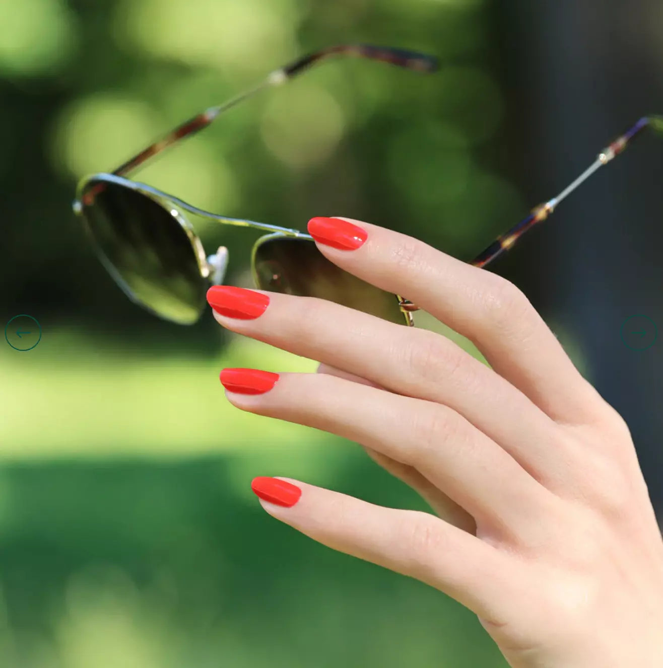 Swatch of Red Coral by Manucurist Paris – glossy vegan polish in a vivid coral red shade