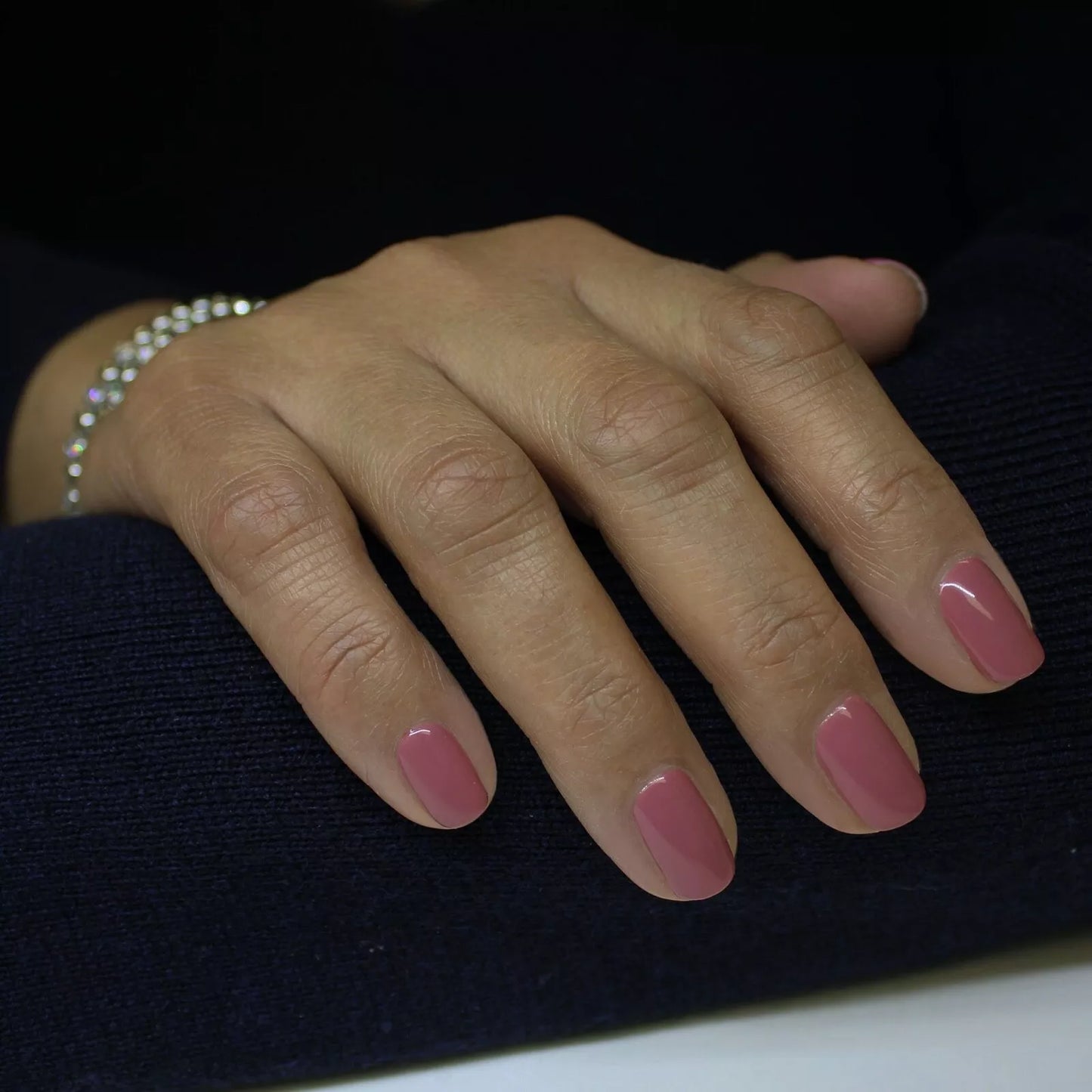 Hand wearing Bio Sculpture Gemini Nail Polish No. 226 Subtle Silhouettes – vegan, delicate pink polish for a refined, versatile manicure