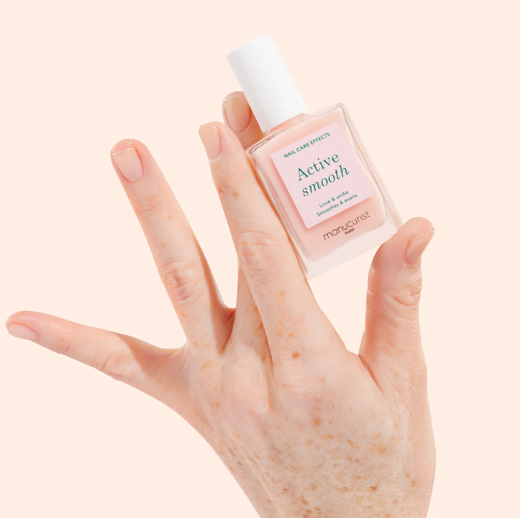 Applying Manucurist Paris Base Coat Active Smooth – base coat for smoothing and protecting natural nails