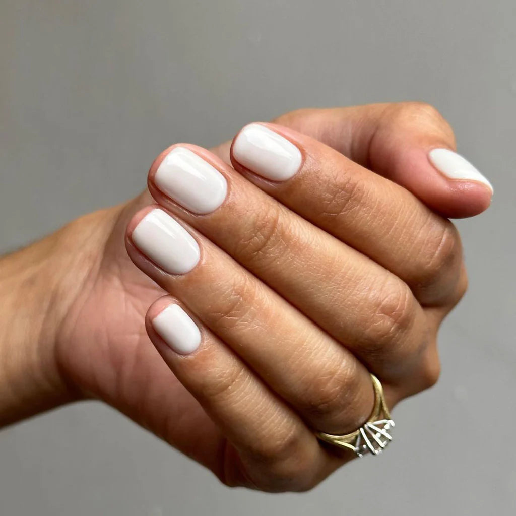 Bio Sculpture Gemini Nail Polish No. 296 Seafoam 14ml. Fingers painted with Gemini Seafoam on dark skin – non-toxic, pastel polish for a chic, versatile look