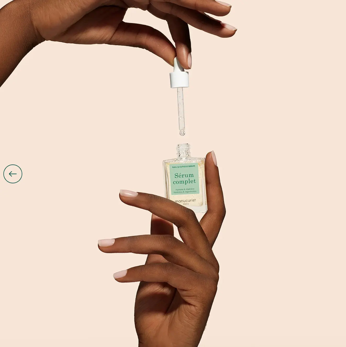 Manucurist Huile Verte Hydrating Green Oil 15ml. Hand holding Manucurist Huile Verte Hydrating Green Oil – vegan, nourishing green oil bottle for hydrated, healthy nails