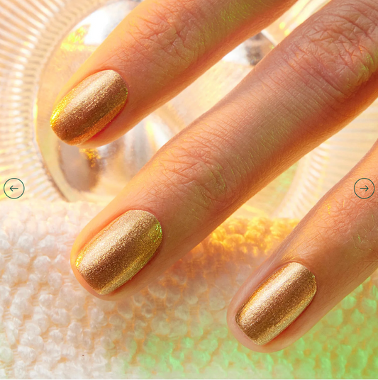 Hand with light skin tone wearing Manucurist Shimmer – soft, vegan nude shimmer polish for a glowing, elegant manicure