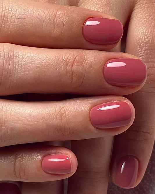 Hand wearing Bio Sculpture Gemini Nail Polish No. 226 Subtle Silhouettes – vegan, subtle pink polish for a chic, understated nail look