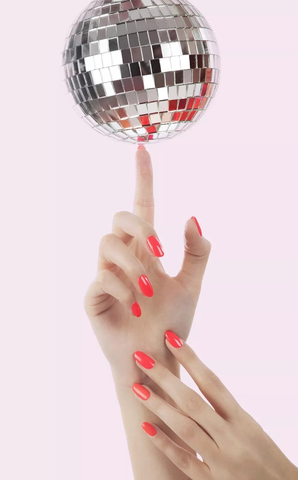Hand wwearing Bio Sculpture Gemini Nail Polish No. 208 Turn Up The Volume – bold, vegan neon orange polish for inclusive, striking manicures