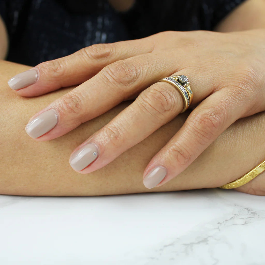 Close-up of Viola polish on light skin – non-toxic, deep violet shade for a sophisticated nail look