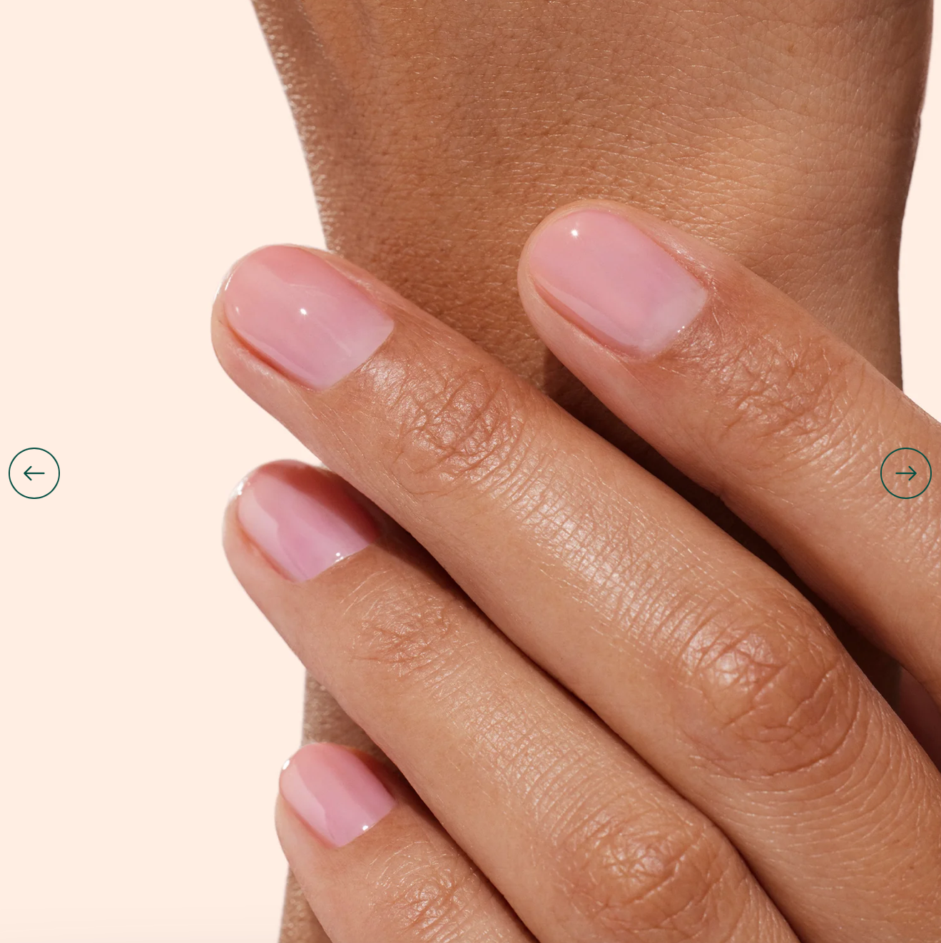 Hand with light skin tone wearing Manucurist Active Glow Blueberry – clear, vegan illuminating base coat for a natural, glowing manicure