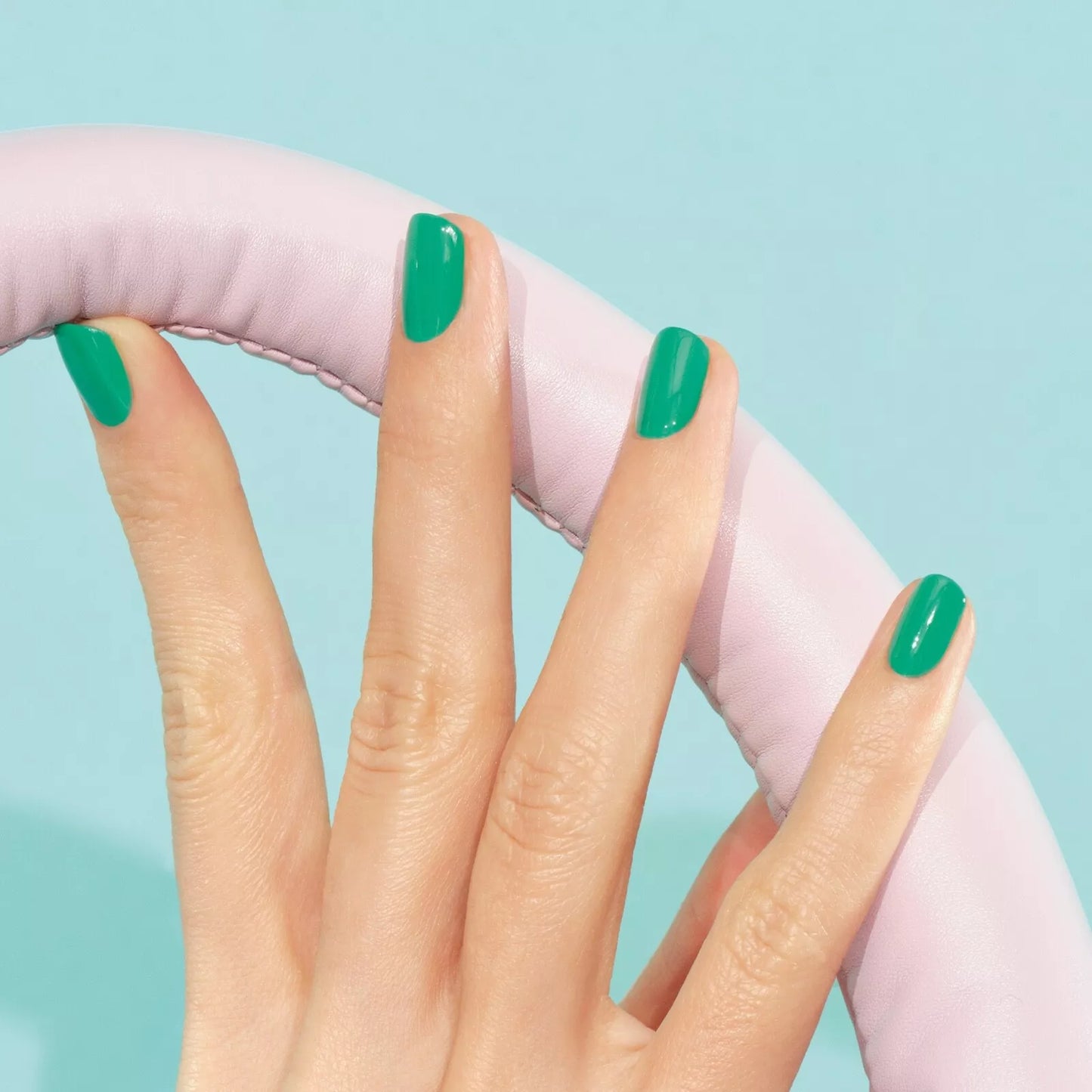 Close-up of Manucurist Brazil polish on light skin – eco-friendly, bold yellow shade for a sunny, standout nail look