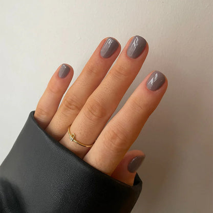 Close-up of Bio Sculpture Gemini Nail Polish No. 115  Eclipse polish on light skin – non-toxic, deep black shade for a striking, modern nail look