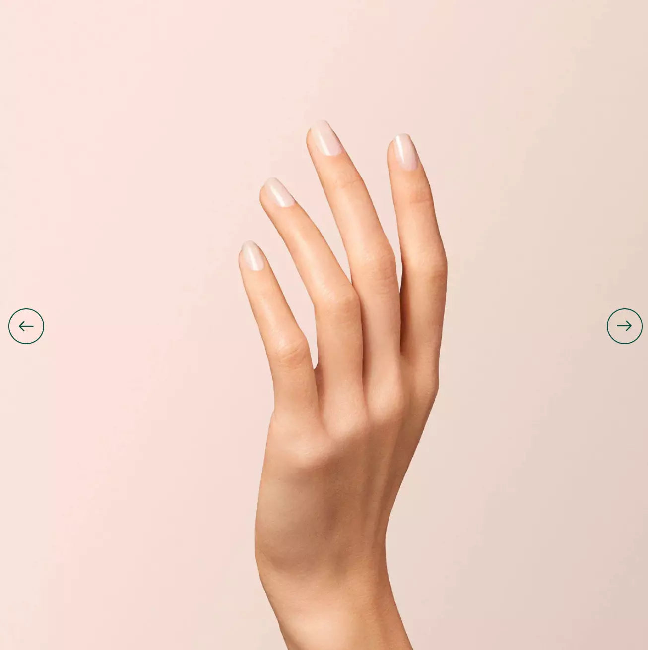 Fingers painted with Manucurist Milky White on light skin – non-toxic, soft white polish for classic elegance