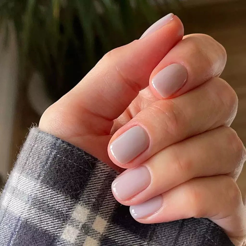 Close-up of Liquorice Soft Serve polish on light skin – non-toxic, creamy black shade for a chic, sophisticated nail look