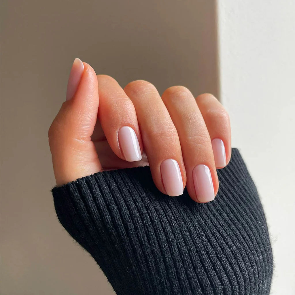 Close-up of Transparent Beauty polish on light skin – non-toxic, translucent nude shade for everyday elegance