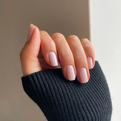 Close-up of Transparent Beauty polish on light skin – non-toxic, translucent nude shade for everyday elegance