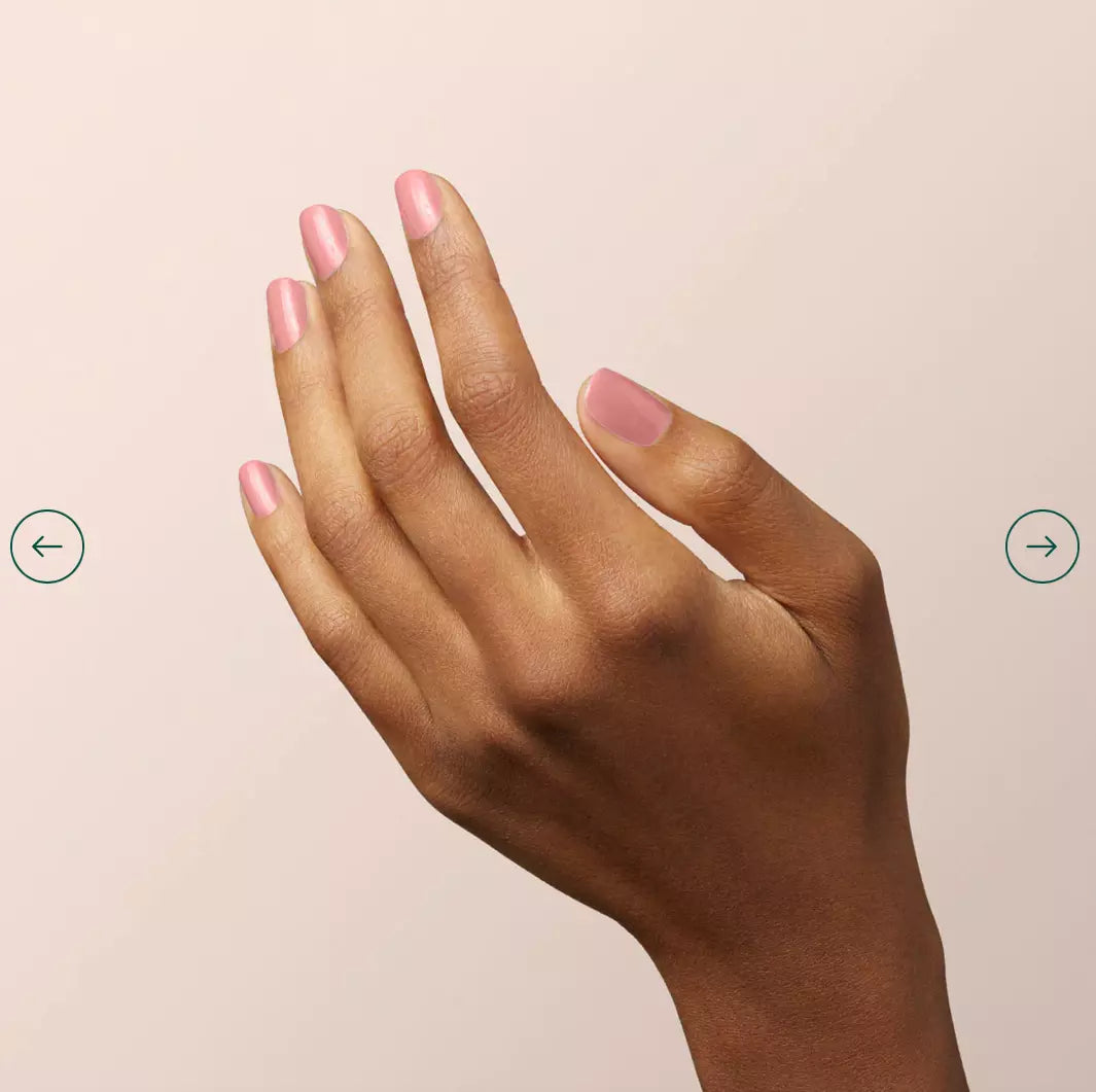 Hand with darker skin tone wearing Manucurist Old Rose – muted, vegan rose pink polish for a sophisticated, inclusive manicure
