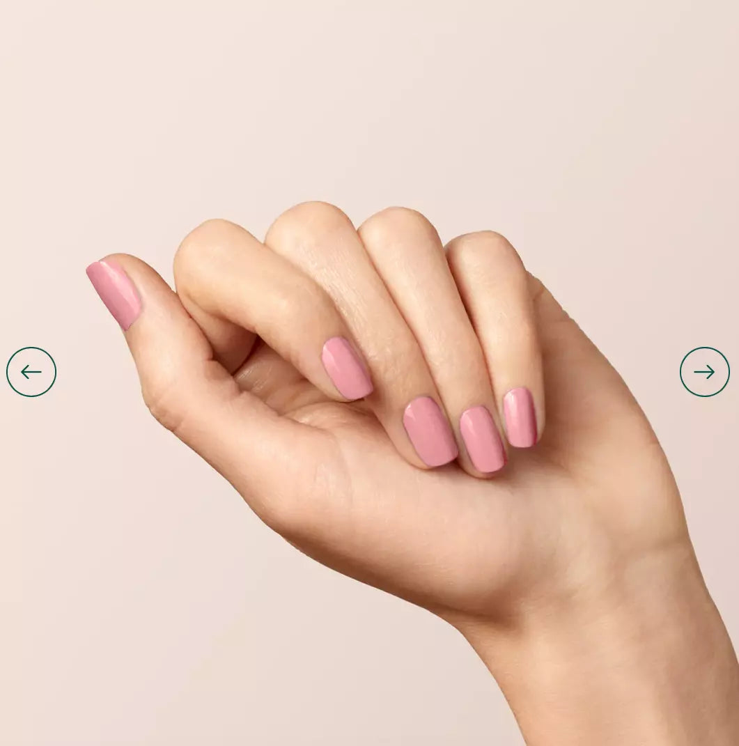 Hand with light skin tone wearing Manucurist Old Rose – soft, vegan rose pink polish for a classic, refined manicure