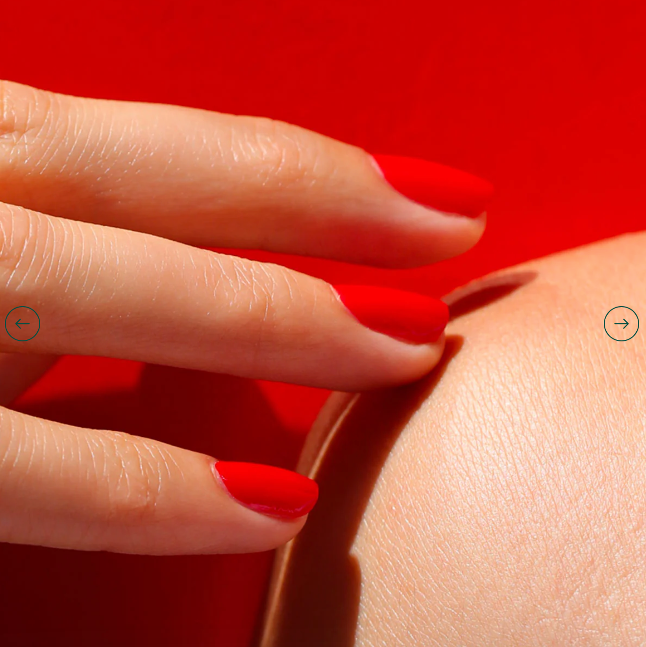 Close-up of Poppy Red polish on light skin – eco-friendly, vivid red shade for elegant nail looks