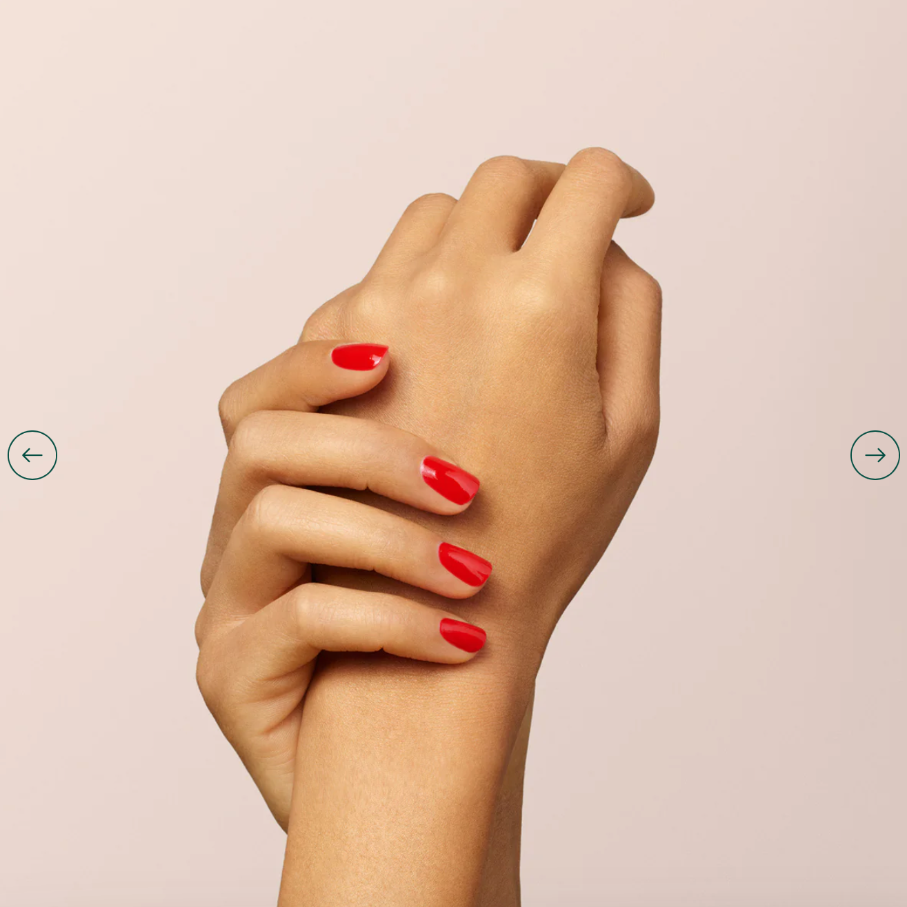 Fingers painted with Manucurist Poppy Red on light skin – non-toxic, intense red polish for modern style