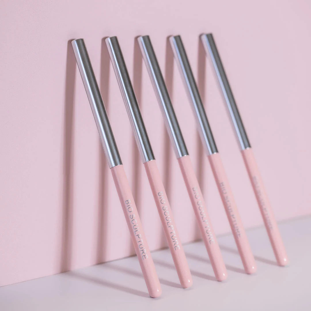 Bio Sculpture Premium Synthetic ROUND No.6 Gel brush set displayed against a soft pink background, highlighting their sleek design.