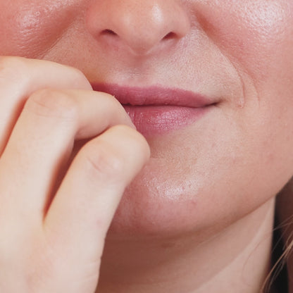 Person biting their nails – highlighting the need for Manucurist Bitter Polish anti-nail biting solution